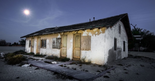 condemned building in the moonlight